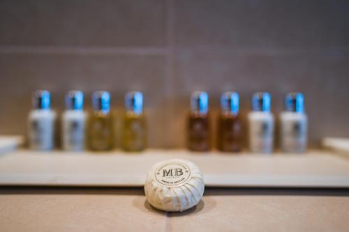 a golf ball sitting on a table with a group of batteries at Hotel Vestibul Palace & Villa - Small Luxury Hotels Of The World in Split
