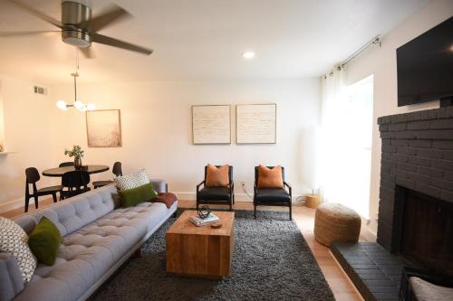 a living room with a couch and a table at Stylish 2 suite condo minutes to food, music, fun in Austin