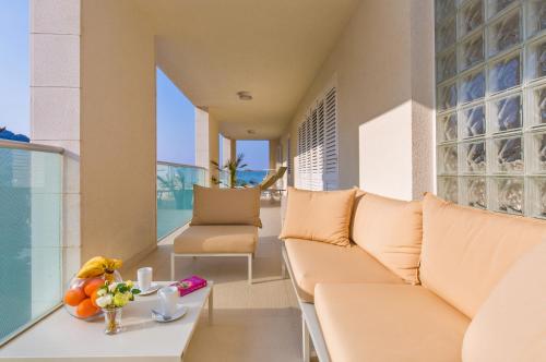 a living room with a couch and a table at Dubrovnik Luxury Residence – L’Orangerie in Dubrovnik