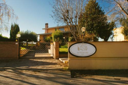 a sign in front of a house at Boteroom Relais in La Volla