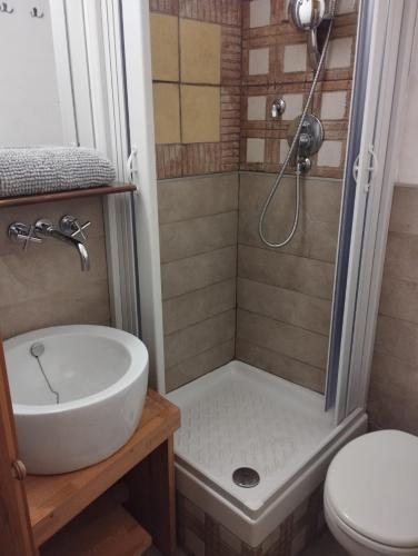 a bathroom with a shower and a sink and a toilet at La Casa di Patty Sutri Home Sweet Home Viterbo in Sutri