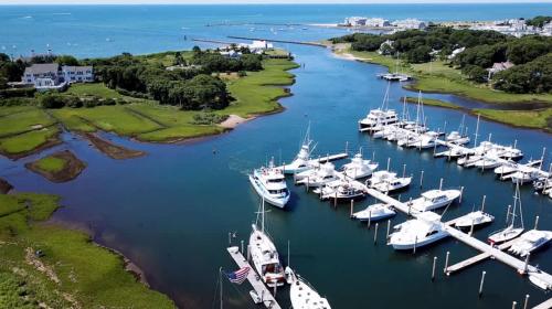 an aerial view of a marina with boats in the water at Sprawling Home 1 Mi to Downtown in Harwich