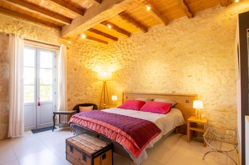 Ένα ή περισσότερα κρεβάτια σε δωμάτιο στο Le petit nid-la morandie