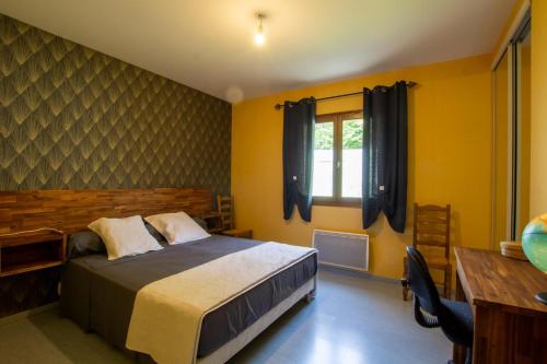 Giường trong phòng chung tại Les tourterelles