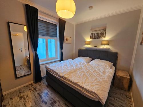 Ένα ή περισσότερα κρεβάτια σε δωμάτιο στο Waldhaus Gertrud - 120 m zum Strand