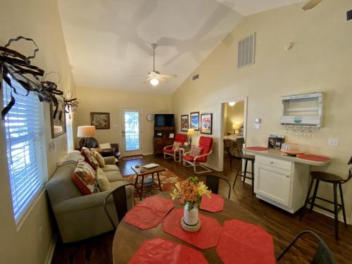 a living room with a couch and a table at Comal Inn in New Braunfels