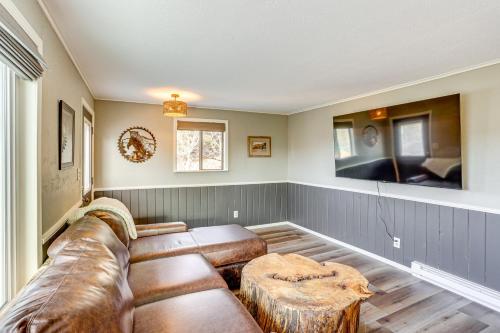 a living room with a couch and a table at 2 Mtn-View Decks and Natural Spring Durango Retreat in Durango