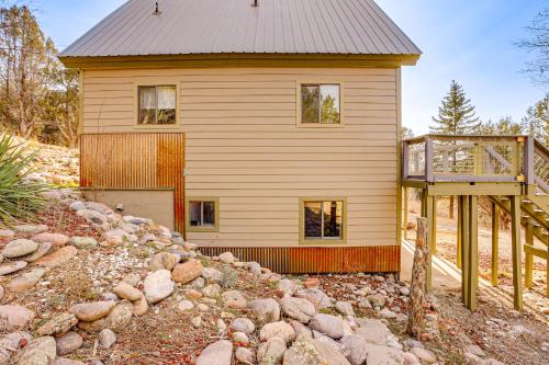 a house on a hill with a porch and a building at 2 Mtn-View Decks and Natural Spring Durango Retreat in Durango