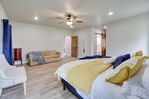 a bedroom with a large bed and a couch at Grandview Spacious and Updated Beds for 10 in Eufaula