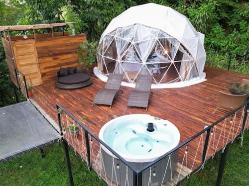 a gazebo with a sink on a wooden deck at Moonlight glamping in Fortuna