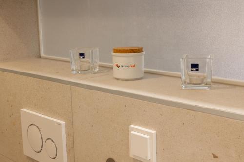 a counter with a jar on a shelf in a room at Turmresidenz Färbergasse Graz in Graz