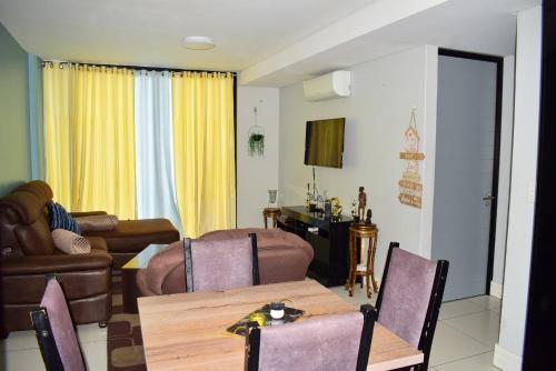a living room with a table and a couch at City Centre Self-Catering Suites in Windhoek
