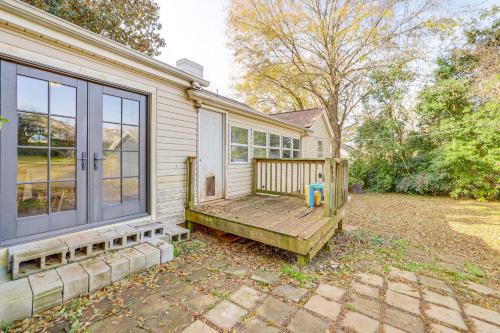 a house with a porch with a bench next to it at 4 Mi to Dtwn Home with Fire Pit in Greenville in Greenville
