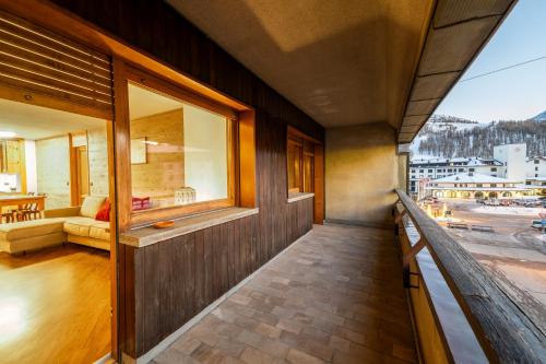 a balcony of a building with a view of a street at Appartamento Prestige in Sestriere