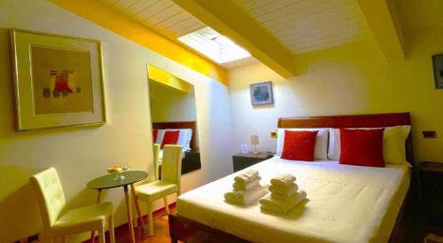 A bed or beds in a room at Ego' Residence Ferrara