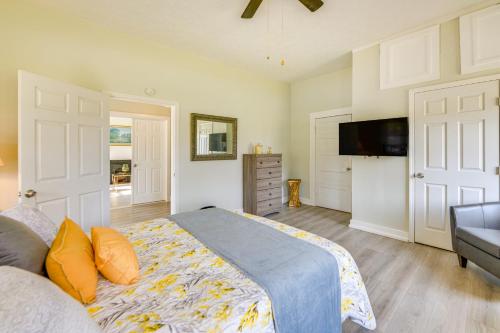 a bedroom with a bed and a flat screen tv at Walk to Riverfront Park Updated Home in Columbus! in Columbus