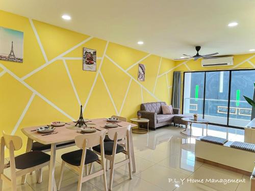 a living room with a table and a couch at Manhattan Condo Ipoh Waterpark PoolView FREE Carpark & Netflix by PLY Home in Ipoh