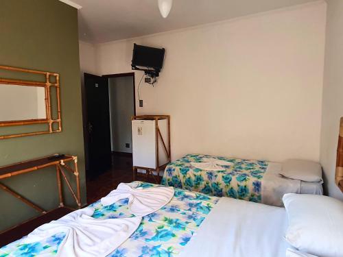 Ένα ή περισσότερα κρεβάτια σε δωμάτιο στο Hotel Pousada Plataforma