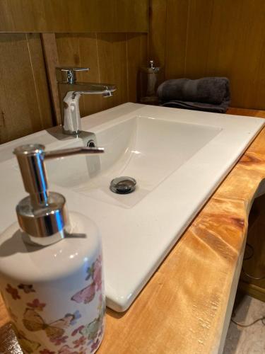 a white sink with a faucet on a counter at Refugios Australes en Corralco in Malalcahuello