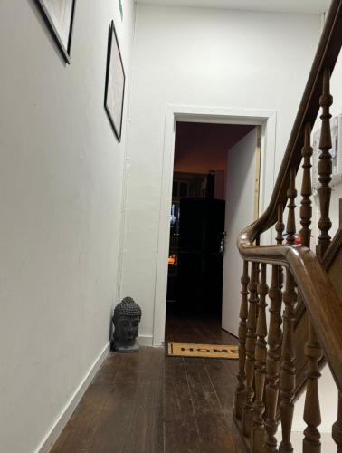 a hallway with a stairway with a stair case at Romeo et juliette in Spa