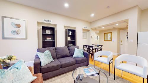 a living room with a couch and chairs at Newly Renovated 2-bed, Back Bay Near Mgh, Bu, Mit in Boston