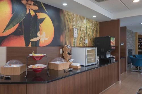 a lobby with a counter with food on it at Fairfield Inn & Suites by Marriott Cleveland Streetsboro in Streetsboro