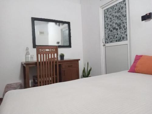 Postel nebo postele na pokoji v ubytování Enderamulla Casual Home