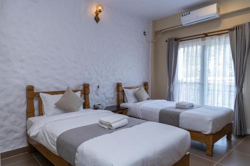 Llit o llits en una habitació de Cozy Home