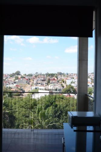 a view of a city from a window at Suites La Gloria Alojamiento independiente in Tepatitlán de Morelos