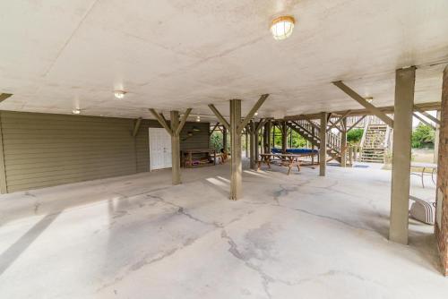 an empty room with wooden poles in a building at Oceanfront Escape with Beach Access in Pawleys Island