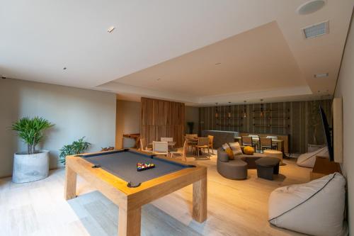a living room with a pool table in the middle at Punto Nima, Spectacular Pool with Ocean View in San José del Cabo