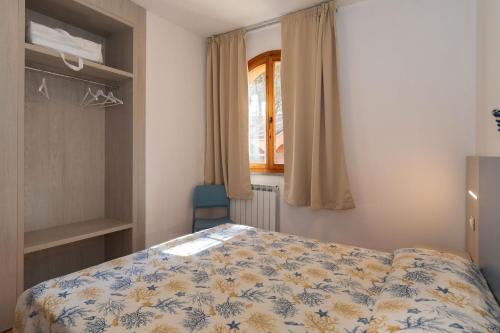 Postel nebo postele na pokoji v ubytování The Charming Marina Village Tipo 3-3 Bedroom Villa 6 persons