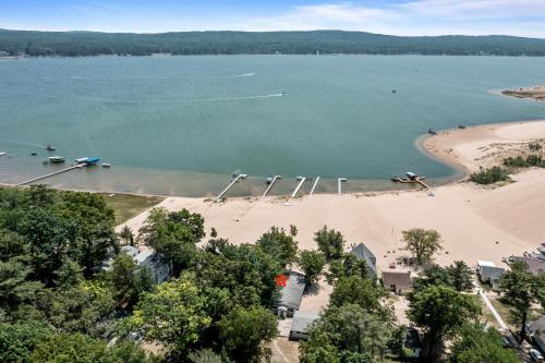 an aerial view of a beach with boats in the water at Dunes Edge- Private Silver Lake Home in Mears