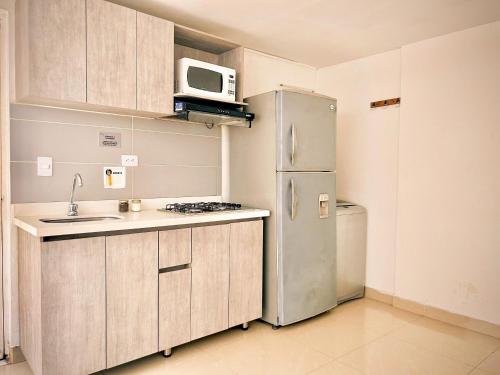 Η κουζίνα ή μικρή κουζίνα στο Apartamentos y Loft Laureles