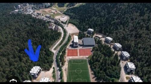 an aerial view of a house in the middle of a forest at Green peace-Bjelašnica in SJJ