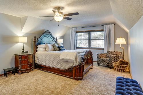 a bedroom with a bed and a ceiling fan at Lakefront Home with Dock and Decks in Gravois Mills! in Gravois Mills