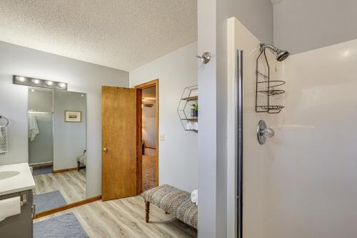 a room with a bathroom with a sink and a mirror at Lakefront Home with Dock and Decks in Gravois Mills! in Gravois Mills