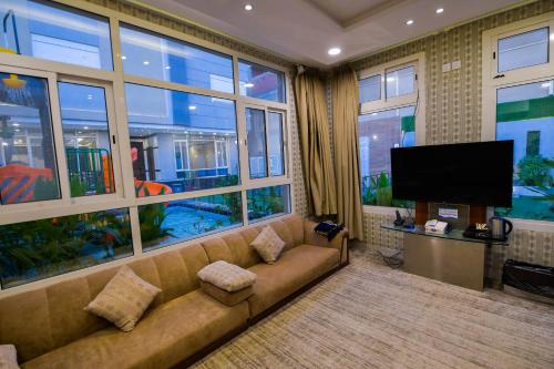 TV a/nebo společenská místnost v ubytování شاليهات اوليفيا