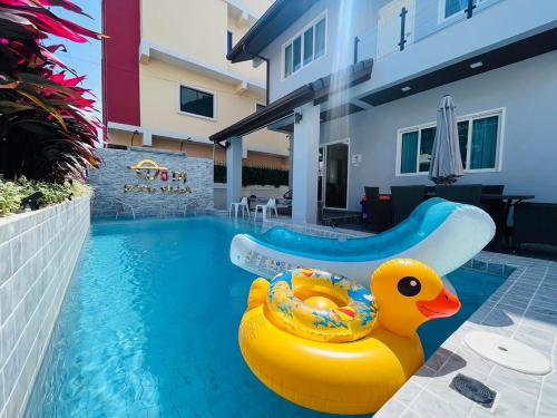 a yellow rubber duck in a swimming pool at DG Pattaya Pool Villa in Pattaya South