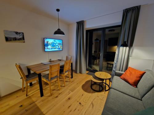 Televízia a/alebo spoločenská miestnosť v ubytovaní Benecko moderní apartmán A30 by AlkaTravel