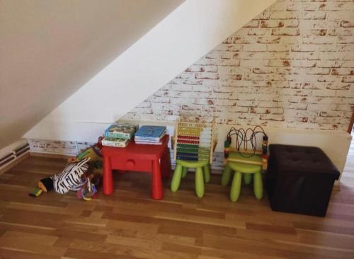a room with tables and chairs in a attic at BellaCiaoApartment in České Budějovice