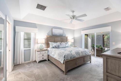 a bedroom with a bed and a ceiling fan at 316 Marco in Marco Island