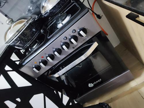 a black and silver stove top oven in a kitchen at Perfect Hideaway in Rungiri