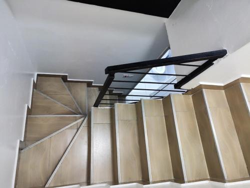 a staircase in a building with a glass ceiling at Perfect Hideaway in Rungiri