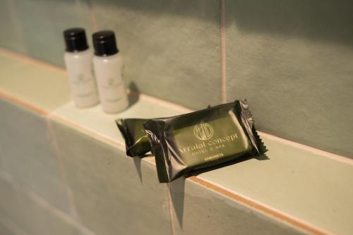 a soap dispenser with water coming out of it at Arraial Concept Hotel in Arraial do Cabo