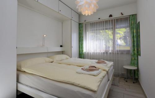 Ένα ή περισσότερα κρεβάτια σε δωμάτιο στο Ferienwohnung C15