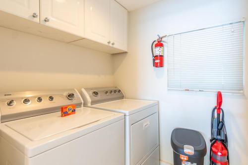 a laundry room with a washer and dryer at Golden Bay 406 in Miami Beach