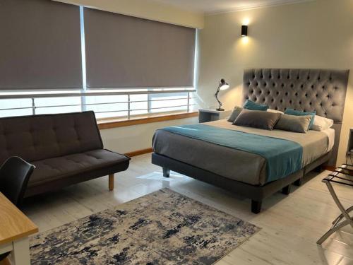 מיטה או מיטות בחדר ב-Apart Hotel Aragon Portal