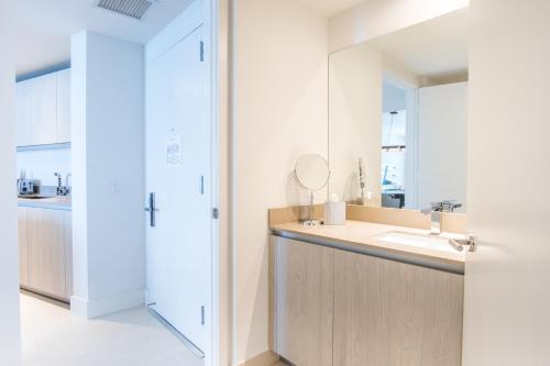 a bathroom with a sink and a mirror at Lyfe Beach Resort 3804 in Beverley Beach