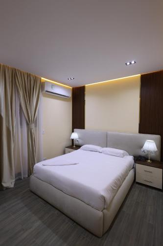 Ένα ή περισσότερα κρεβάτια σε δωμάτιο στο SOLAYA Sunshine inn
